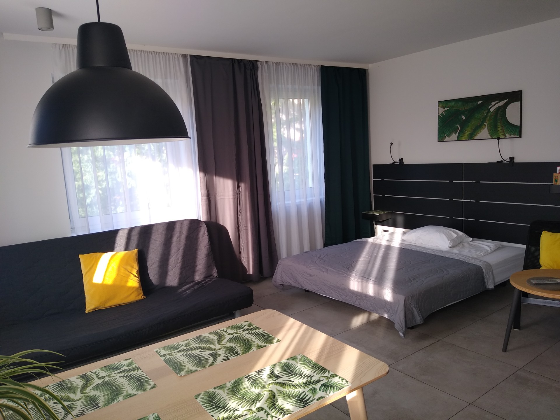 Studio apartment bedroom and lounge area, styled and ready for guests — Property Presentation Reset, Poznań apartment listing